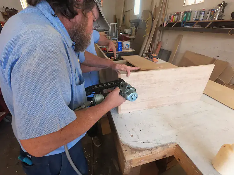 Craftsman cutting a cabinet panel in the RV Renovators cabinet shop